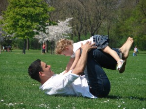 Photograph of a dad balancing a child, accompanying Memories and Moments - an Interview with Steve Pankhurst about Liife. Image copyright www.freeimages.com / Melbia.