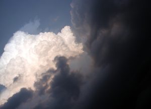 Photograph of the sky with contrasting white and grey clouds, accompanying the historytracings blog post “Good Times and Bad Times - Thursday Thoughts” from historytrace. Image copyright: www.freeimages.com / Maria Herrera.